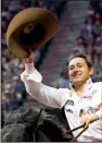  ?? STEVE F GRAY/PRCA PRORODEO ?? Clayton Biglow celebrates his bareback bronc riding championsh­ip at the National Finals Rodeo on Sunday in Las Vegas.