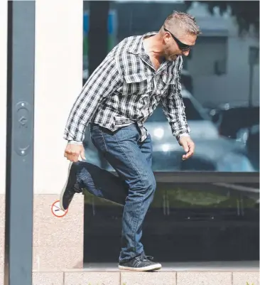  ?? Picture: ANNA ROGERS ?? BOLTER: Matthew David Page makes a quick exit from the Cairns courthouse yesterday. BELOW: Jasmine Laird with her pet dog Aussie.