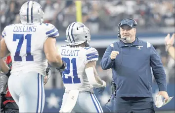  ?? RON JENKINS – THE ASSOCIATED PRESS ?? La’el Collins and Ezekiel Elliott celebrate with Mike McCarthy, who is in his second season as head coach of the Cowboys.