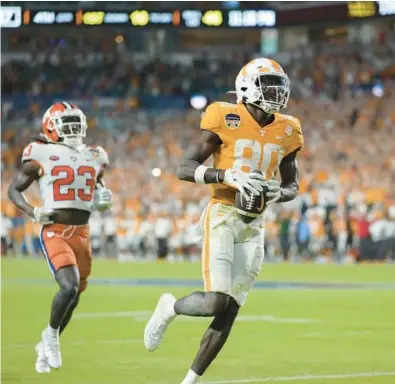  ?? REBECCA BLACKWELL/AP ?? Tennessee wide receiver Ramel Keyton leaves Clemson cornerback Toriano Pride Jr. behind as he scores a touchdown during the second half of the Orange Bowl on Friday in Miami Gardens.