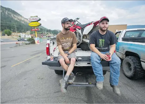 ?? JASON PAYNE ?? Laird Tutte, left, and Geremy Murphy have made preparatio­ns in case the evacuation order is given for Williams Lake residents, with Tutte’s pickup already loaded down with items such as a dirt bike and generator. Tutte also has another older truck...