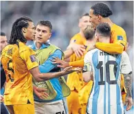  ?? ?? Lionel Messi and Virgil van Dijk in the middle of the end-of-match chaos on Friday night