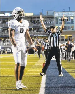  ??  ?? Old Dominion wide receiver Jonathan Duhart celebrates the eventual winning touchdown against Virginia Tech. He caught it with 5:11 remaining to break a 35-35 tie.