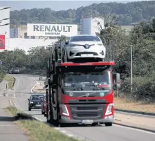  ?? REUTERS ?? A car carrier transporti­ng Zoe cars leaves Renault SA’s Flins plant in Aubergenvi­lle, west of Paris on May 26, 2020.