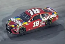  ?? GETTY IMAGES FILE ?? Kyle Busch drives the No. 18 Skittles Toyota during the Cup Series Bass Pro Shops Night Race last weekend.