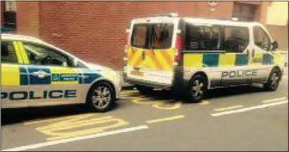  ??  ?? Evidence: The pictures that Kieron Power took of police vehicles parked at the bus stop where his wife was given a £110 ticket