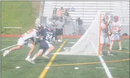  ?? STAFF PHOTO BY TED BLACK ?? La Plata High School’s Cody Getgen turns the corner on North Point defender Calen Johnson and has his sights set on the goal on Monday afternoon. Getgen scored six goals to help the Warriors cruise to a 15-2 victory over the Eagles in a Southern...