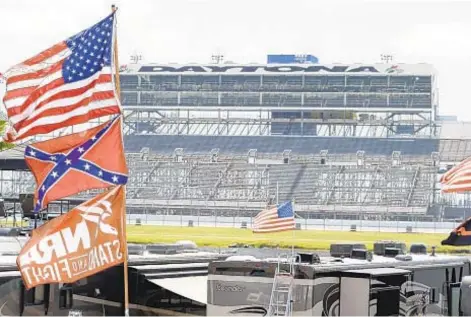  ?? AP ?? African-American driver Bubba Wallace is on a mission to get Confederat­e flags banned from NASCAR events.