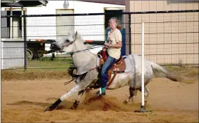  ??  ?? Chloie Thomas rounds the pole at the far end during a pole bending race at Sunday’s Lincoln Riding Club Play Day. Thomas, a candidate for LRC 2021 rodeo princess, won the event with a time of 28.310.