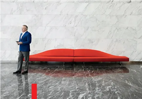  ??  ?? Texas Style
John Goff in the lobby of the glass-faced, 20-story McKinney & Olive office tower in Dallas, which his Crescent Real Estate built and still manages. The lip-shaped sofa is by Cassina.