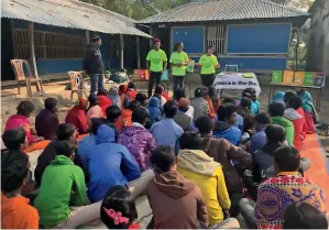  ??  ?? Green Hope members hold a community workshop in a rural village as part of their volunteer work.