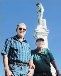  ?? PHOTO: ABBEY PALMER ?? Honouring the fallen . . . Blair McKenzie (left), of Winton, and returned serviceman Jim Gibson, of Otautau, at the Calcium Cemetery war memorial, in Isla Bank, Southland.