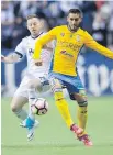  ??  ?? Whitecaps defender Jordan Harvey, left, and Tigres' forward Ismael Sosa battle for the ball at B.C. Place on Wednesday.