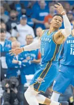  ??  ?? Russell Westbrook (left, with Steven Ada a as the Thunder pegged back a 25-point le e