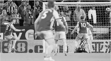  ??  ?? Burnley’s Irish midfielder Jeff Hendrick (left) scores his team’s first goal during the English Premier League football match between Burnley and Newcastle United at Turf Moor in Burnley, north west England. — AFP photo