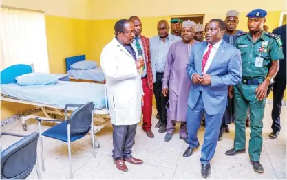  ??  ?? Governor Simon Bako Lalong of Plateau State (2nd right), inspects facilities at the isolation centre in Jos yesterday, to ascertain medical officers’ preparedne­ss in handling the Coronaviru­s pandemic