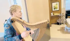  ??  ?? Edie Elkan plays the harp as part of the music therapy program at Robert Wood Johnson Hospital in New Jersey.