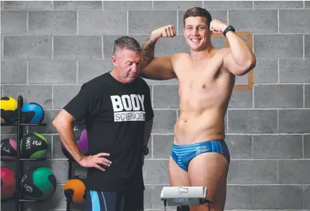  ?? Picture: ADAM HEAD ?? Gold Coast Titans prop Jarrod Wallace and trainer Craig Catterick at the weigh-in.