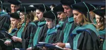  ?? BRUCE R. BENNETT/THE PALM BEACH POST 2015 ?? Members of the College of Medicine Class of 2015 recite the Hippocrati­c Oath at the conclusion of FAU’s Charles E. Schmidt College of Medicine’s inaugural Doctor of Medicine commenceme­nt ceremony.