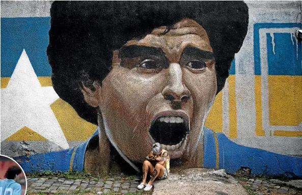  ?? GETTY IMAGES ?? Yamila Rodriguez, a member of the women’s team at Boca Juniors, the Argentinia­n club where Diego Maradona came to prominence, cries in front of a painting of the 1986 World Cup winner. Left, Wynton Rufer gets a pat on the head from Maradona after a Uefa Cup match between Rufer’s Werder Bremen and Maradona’s Napoli in 1989.