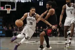  ?? THE ASSOCIATED PRESS ?? In this Sunday, March 8, 2020 file photo, Brooklyn Nets’ Spencer Dinwiddie (26) drives to the basket around Chicago Bulls’ Coby White during the second half of an NBA basketball game at the Barclays Center in New York.