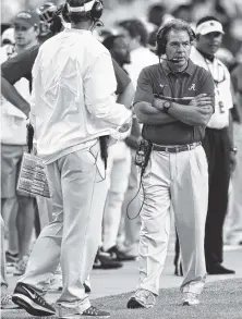  ?? STAFF FILE PHOTO BY ROBIN RUDD ?? Alabama coach Nick Saban, seen here walking the sidelines of the game with Tennessee last year, says his offense will be challenged early on this season.