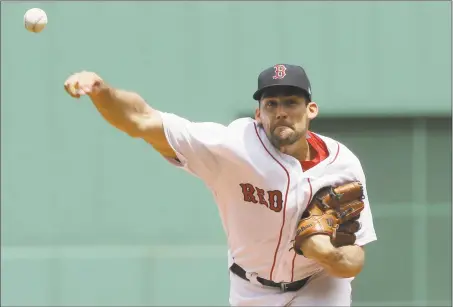 ?? Steven Senne / Associated Press ?? Nathan Eovaldi threw seven shutout innings in his first game as a member of the Red Sox on Sunday.