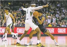  ?? RAY CARLIN/ASSOCIATED PRESS ?? Baylor forward Flo Thamba, left, applies the defensive pressure on Villanova forward Jermaine Samuels during the first half of Sunday’s game in Waco, Texas.