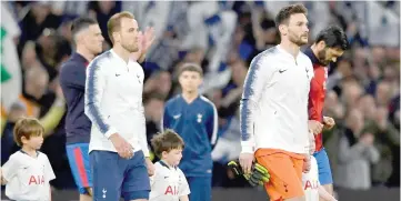  ?? — Reuters photo ?? File photo shows Tottenham’s Harry Kane (left) and Hugo Lloris walk out on to the pitch before the English Premier League match between Tottenham Hotspur and Crystal Palace at Tottenham Hotspur Stadium in London.