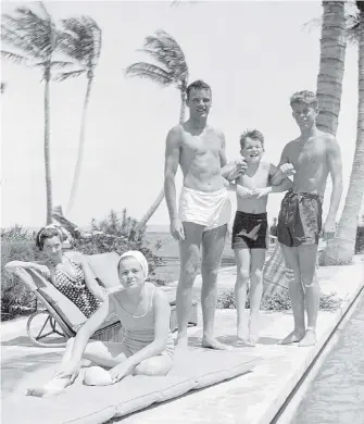  ??  ?? In this October 1936 photo from the Kennedy Family Collection, John F. Kennedy, right, Robert F. Kennedy, second from right, and Patricia Kennedy, front left, pose with friends in Palm Beach, Florida.