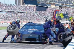  ?? DAVID YEAZELL/USA TODAY SPORTS ?? NASCAR Cup Series driver Joey Logano (22) gets service after stage one at Atlanta Motor Speedway.