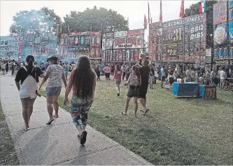  ?? METROLAND FILE PHOTO ?? Montebello Park will be buzzing with action during the St. Catharines Rotary Ribfest, set to take place Friday to Monday at the downtown park.