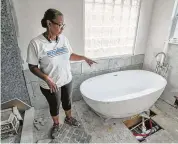  ?? Steve Gonzales / Houston Chronicle ?? Carolyn Brown and her husband are rebuilding their home, which sits near a canal, in northeast Harris County after it flooded during Harvey.