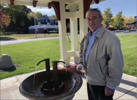  ?? PHOTO PROVIDED ?? City of Saratoga Springs Commission­er of Public Works Anthony “Skip” Scirocco enjoys a sample of the iron rich mineral water that was believed to help cure blood and skin diseases.