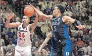  ?? [AP PHOTO/LEE LUTHER JR.] ?? Virginia Tech forward Kerry Blackshear Jr. and Duke's Tre Jones reach for a rebound during the second half Tuesday in Blacksburg, Va.