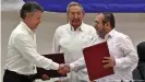  ??  ?? The Colombian government and FARC guerrillas signed a peace agreement at a 2016 ceremony in Havana