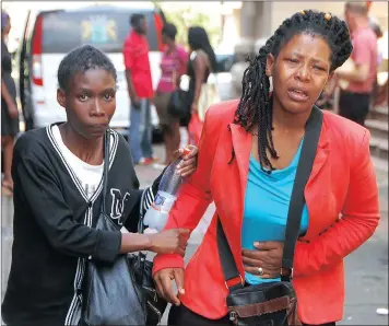  ?? PICTURE: PHUMLANI THABETHE ?? Ntombifiki­le Phewa, right, was comforted by a relative yesterday after her ex-boyfriend, Sbusiso Xaba, pleaded guilty to killing her 11-year-old son, Sphesihle.
