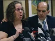  ?? BILL SIKES — THE ASSOCIATED PRESS ?? Alexa MacPherson, a victim of clergy sex abuse, reacts beside attorney Mitchell Garabedian, right, Wednesday in Boston, to the death of Cardinal Bernard Law, the disgraced Boston archbishop who epitomized the Catholic Church’s failure to protect...