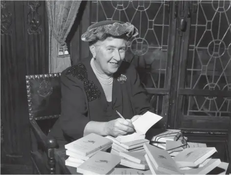  ??  ?? Agatha Christie autographi­ng French editions of her books, circa 1950 (photo: Hulton Archive/Getty Images)