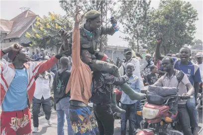  ?? Picture: AFP ?? HAIL THE HERO. A Congolese soldier is tossed in the air by demonstrat­ors denouncing the internatio­nal community’s silence about the crisis in the east of the Democratic Republic of Congo.
