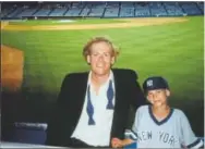  ?? Photos courtesy of John Ottavino ?? Adam Ottavino and his father, John, pose for a photo at Yankee Stadium in 1995. John coached Adam’s youth baseball teams.