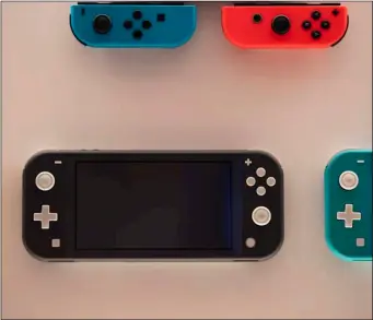  ?? AP PHOTO/JAE C HONG ?? In this Jan, 23 file photo, Nintendo Switch game consoles are on display at Nintendo’s official store in the Shibuya district of Tokyo.