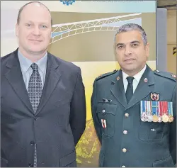  ?? DAVE STEWART/TC MEDIA ?? Major Trevor Jain, right, with his boss, Dr. Ron Whalen, chief of emergency medicine at the Queen Elizabeth Hospital. Whelan was one of six employers recognized by the Canadian Forces Liaison Council in Charlottet­own last Wednesday.