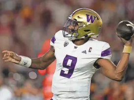  ?? RYAN SUN/AP ?? Washington quarterbac­k Michael Penix Jr. throws a pass during the first half of his team’s game against Southern California on Saturday in Los Angeles.