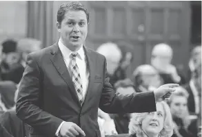  ?? ADRIAN WYLD / THE CANADIAN PRESS ?? Tory Leader Andrew Scheer rises during question period Wednesday. Scheer came out swinging against the Global Compact for Safe, Orderly and Regular Migration.