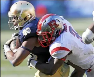  ?? AP Photo ?? Rutgers’ Steve Longa, right, led the team in tackles while playing at middle linebacker, but will move to the weakside this coming season when the Scarlet Knights make their Big Ten debut.