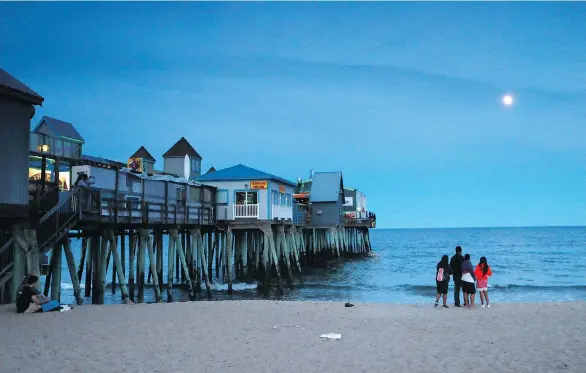  ?? ROBERT F. BUKATY/THE ASSOCIATED PRESS ?? Old Orchard Beach in Maine has long been a popular summer destinatio­n for French-speaking Canadians from Quebec. Innkeepers in the region say despite growing strife between the U.S. and Canada over trade, tourism from Canada remains strong.