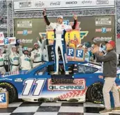  ?? WADE PAYNE/AP ?? Denny Hamlin celebrates after winning the NASCAR Cup Series race at Bristol Motor Speedway on Sunday in Bristol, Tennessee. It was the 43-year-old driver’s fourth career Cup victory at the famed short track.