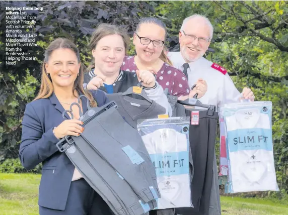  ??  ?? Helping them help others Lyn McClelland from Scottish Friendly with volunteers Amanda Macdonald, Jade Macdonald and Major David Wing from the Renfrewshi­re Helping Those in Need