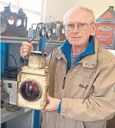  ?? ?? Des Byrne shows off one of the train lamps.